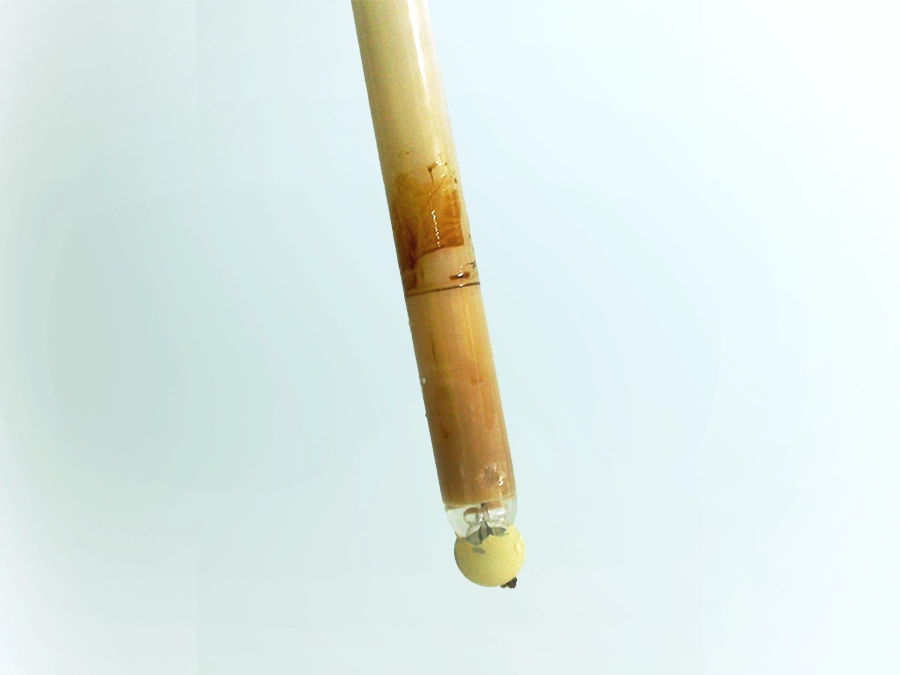 Encrusted yellow sensor on light background